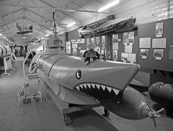 Mooch monkey on a Biber submarine at the Submarine Museum.