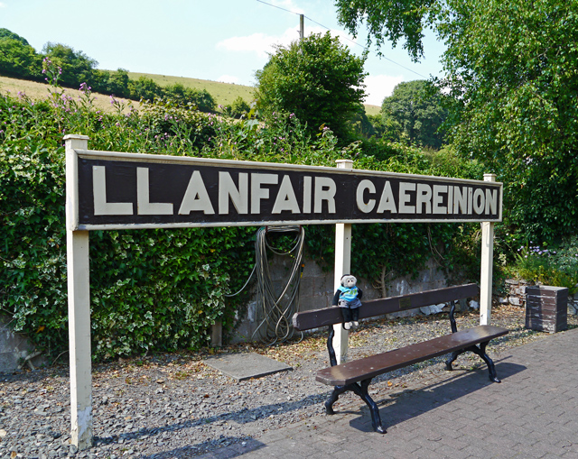 Mooch monkey at the Welshpool & Llanfair Light Railway - Llanfair Caereinion station sign