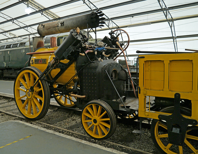 Mooch monkey sits on a Rocket replica steam engine at the Railway Museum in York