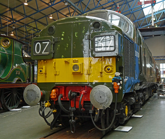 Mooch monkey on a big deisel locomotive at the National Railway Museum in York