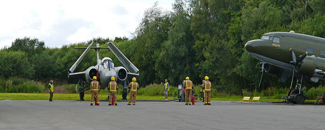 Mooch monkey at Yorkshire Air Museum, Elvington - the Fire Service watches as the Blackburn Buccaneer S2 starts