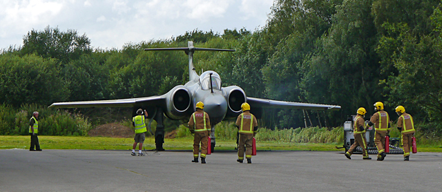 Mooch monkey at Yorkshire Air Museum, Elvington - the Fire Service watches as the Blackburn Buccaneer S2 starts