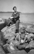 Ron (?Ken) Smith and the little German girl on Cuxhaven beach. 1946.